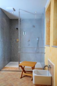 a bathroom with a shower and a sink at Landhotel Plauen - Gasthof Zwoschwitz in Plauen