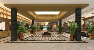 a lobby with potted plants in a building at Hotel Riu Palace Phuket - All Inclusive in Mai Khao Beach +30 photos