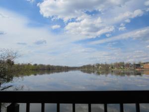 a view of a large lake with a cloudy sky at Main Street Inn in Lowell