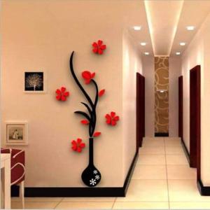 a hallway with a vase with red flowers on the wall at ROYALrest HOTELS in Elele