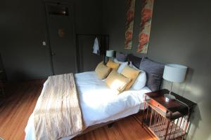 a large bed in a room with a couch at -Casa Haydée- in Paysandú
