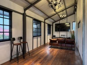 a large living room with wood floors and a ceiling at The Lumpang Resort in Kerling