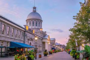 a city street with a large building with a dome at Testing in Montreal