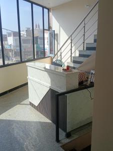 a room with stairs and a counter in a building at SK Hotel Raisingh Nager in Rāisinghnagar