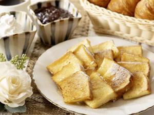 a plate of food with bread and a basket of pastries at KOKO HOTEL Nagoya Marunouchi in Nagoya +94 photos