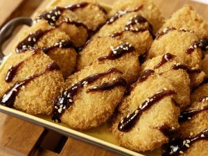 a plate of cookies with chocolate sauce on top at KOKO HOTEL Nagoya Marunouchi in Nagoya