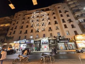 a building with a lion sign on the side of it at colombia inn cairo in Cairo