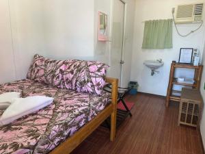 a living room with a couch and a sink at Little Miami Beach Resort in Anda +22 photos