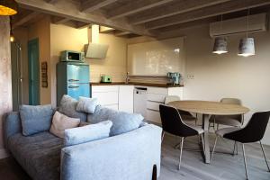 a living room with a couch and a table at Apartamentos Catamarán Azul in Suances