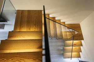 a staircase in a house with wood paneling at Apartamentos Catamarán Azul in Suances +33 photos