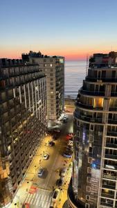 a view of a city with tall buildings and the ocean at Adlia Flight Spot in Batumi