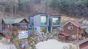 an aerial view of a house with a garden at Fortune Rising Sun Hill Pension in Pocheon