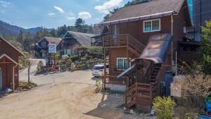 a house with a rv on the side of it at Fortune Rising Sun Hill Pension in Pocheon