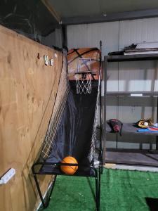 a basketball hoop with a ball on a net at Gyeongju Heimisch Pool Villa in Gyeongju
