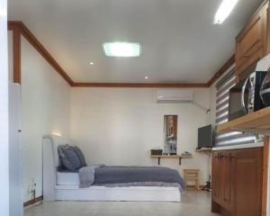 a bedroom with a bed in a room at Pyeongchang underhill pension in Pyeongchang