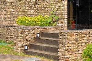 a stone building with stairs in front of a window at Yangpyeong Newspace in Yangpyeong