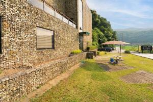 a brick building with a window and an umbrella at Yangpyeong Newspace in Yangpyeong +8 photos