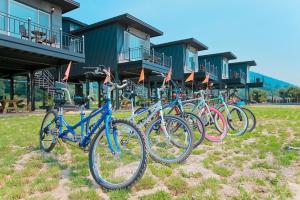 a row of bikes parked in front of a building at Jnj Village in Suncheon