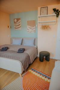 a bedroom with a large bed and a rug at sleepArt cozy in Celle
