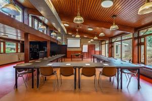 a large conference room with a large table and chairs at Stayokay Hostel Apeldoorn - Fully renovated March 2026 in Apeldoorn