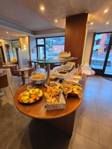 a table with food on it in a restaurant at Euro Hotel in Edolo