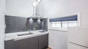 a kitchen with a sink and a window at Gyeongju Areum Maru in Gyeongju