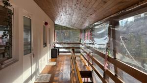 a hallway of a house with a window at Pensiunea Izabel in Lacu Rosu