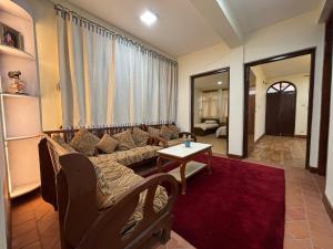 a living room with a couch and a table at L&S apartment in Kathmandu