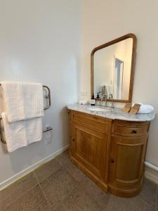 a bathroom with a sink and a mirror at The Nook in Greytown +16 photos
