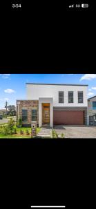 a rendering of a house with a garage at Saltwater at Warilla Beach in Lake Illawarra