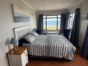 a bedroom with a bed and a window at Sonnestrale in Margate