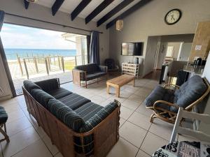 a living room with a view of the ocean at Sonnestrale in Margate