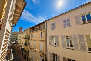 a view of an alley between two buildings at Old Antibes 1 Bedroom 4 Persons in Antibes