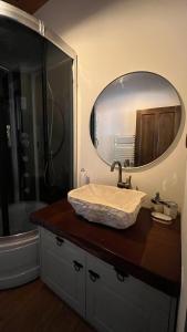 a bathroom with a sink and a mirror at SİSU ALAÇATI OTEL in Çeşme
