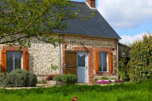 a brick house with a gambrel roof at Maison Mayjune Cottage in Irai +39 photos