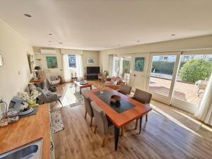 a large living room with a table and chairs at KRAB160 in Sint Annaland