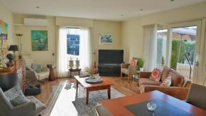 a living room filled with furniture and a tv at KRAB160 in Sint Annaland
