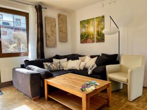 a living room with a couch and a coffee table at Ferienpark im schönen Falkenstein 7 in Falkenstein