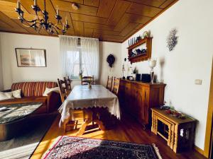 a living room with a table and a couch at Ferienwohnung "Korte" in Rechlin +7 photos