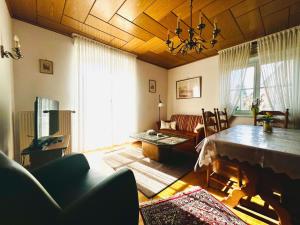 a living room with a couch and a table in it at Ferienwohnung "Korte" in Rechlin