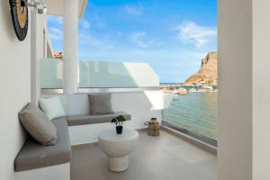 a room with a window with a view of the ocean at Aether-Castle vista in Monemvasia