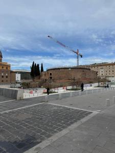 a building under construction with a crane in the background at 56 Orange Street Luxury Accommodation in Rome