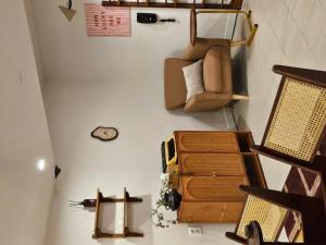 a living room with a cross on the wall at Jeonju Hotel Stay Bok-e in Jeonju +18 photos