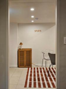 a dining room with a table and a glass table at Jeonju Hotel Stay Bok-e in Jeonju