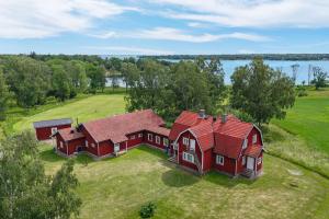 an aerial view of a large red house on a field at Lidö Värdshus in Lidö