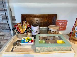 a table with a box and some items on it at Greg House 49 - Chambres d'Hôtes in Beaupréau