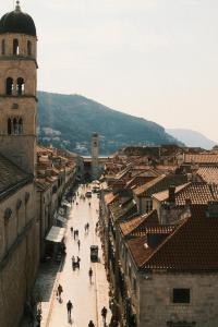 a view of a city with buildings and a clock tower at Antaeus Old Town Residence in Dubrovnik