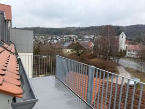 a balcony with a view of a city at Schloss Espasingen Apartment 4 in Stockach