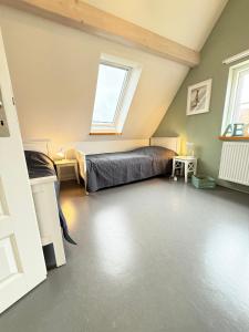 a bedroom with a bed and a window at Haus Charlotte mit Meerblick in Fehmarn
