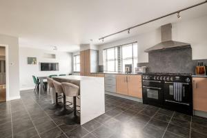 a kitchen with a stove and a counter top at Rosemount - Kilrenny in Kilrenny